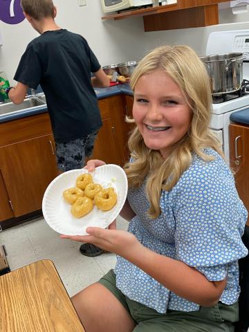 A student displays her bread 