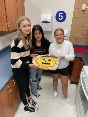 Kids pose with their fruit pizza