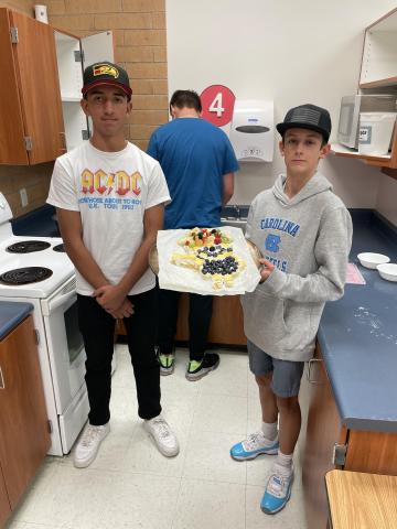 Kids pose with their fruit pizza