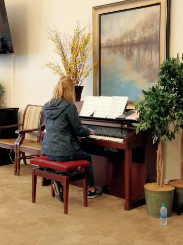 Melanie plays piano at Assisted Living Center