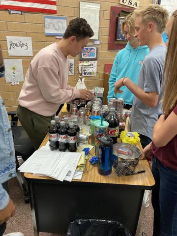Kids setting up Mrs. Rowley’s new Diet Coke Tower!