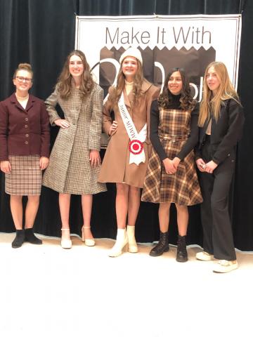 Make is with wool winners pose for the camera 