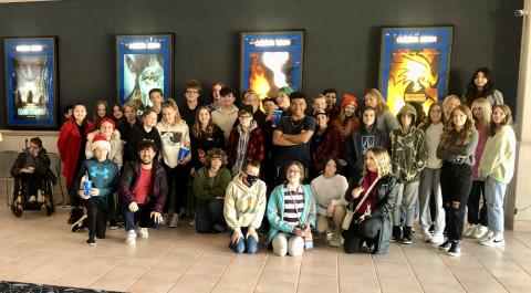 Lit and film kids pose for photo at the movie theatre where they watched "Strange World"